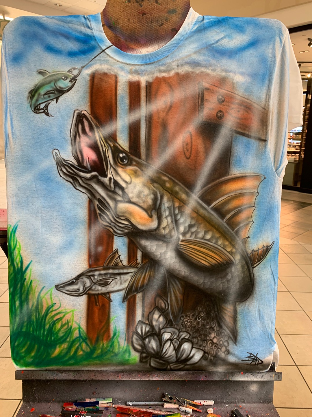 Custom blue airbrushed shirt featuring fish and dock scenery