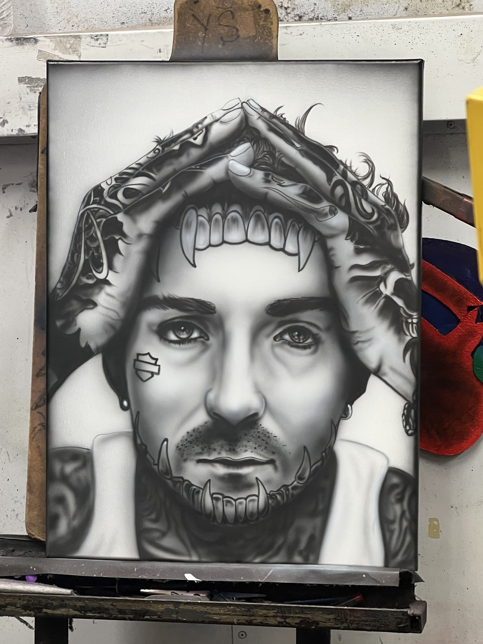 Detailed black-and-white airbrushed portrait artwork